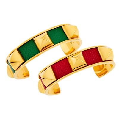 Lot 2080 - Hermès Pair of Gilt-Metal and Red and Green Leather Stud 'Medor' Cuff Bangle Bracelets