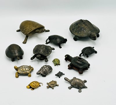 Lot 1127 - Fifteen Cast Bronze or Carved Hardwood Turtles