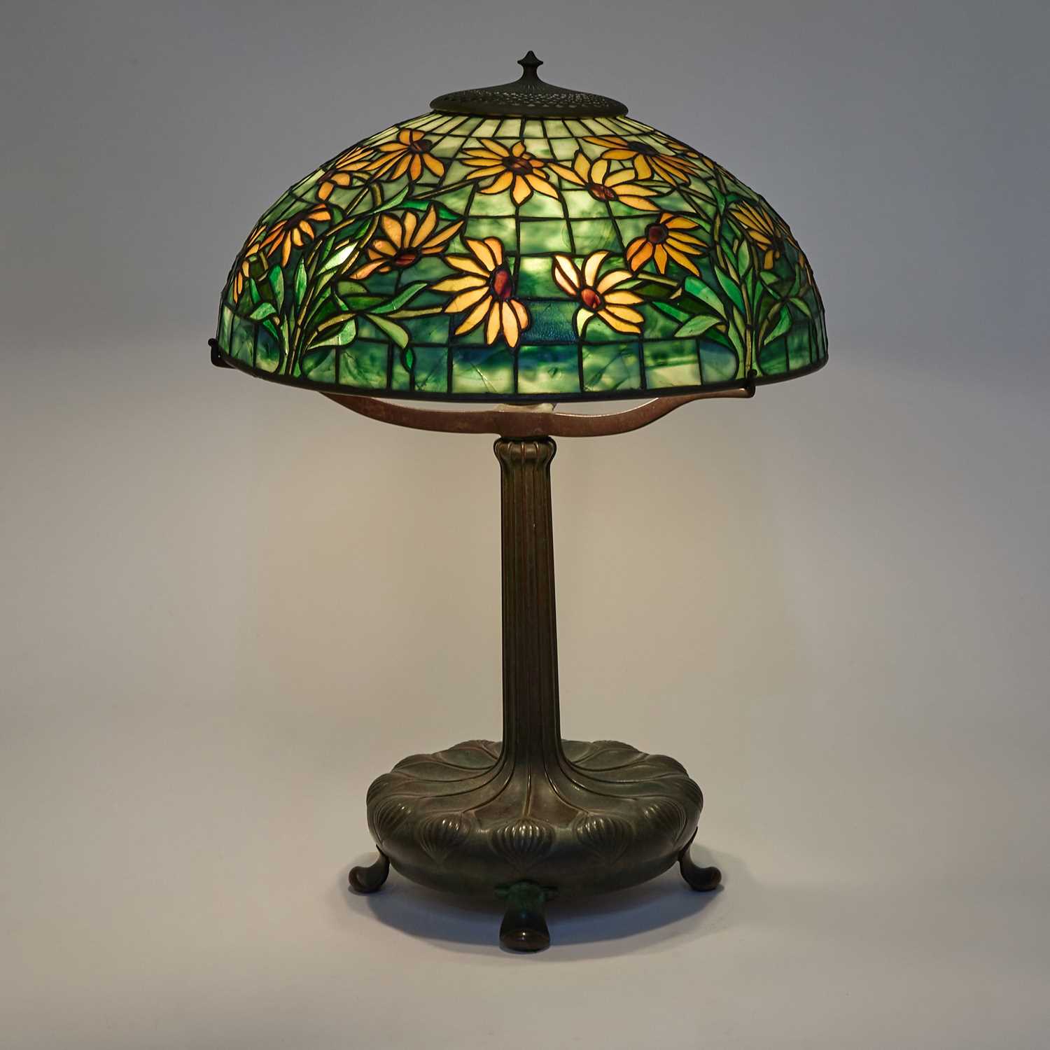 Lot 245 - Tiffany Studios Bronze and Leaded Glass Black-Eyed Susan Table Lamp