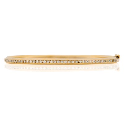 Lot 1095 - White Gold and Diamond Bangle Bracelet