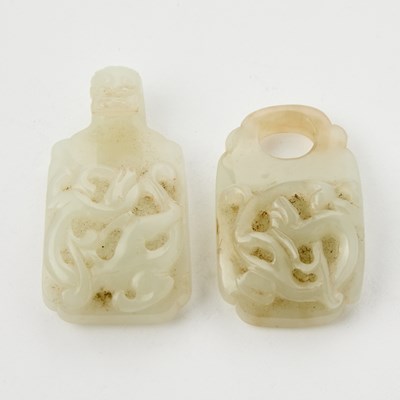 Lot 25 - A Chinese Carved White Jade Two-Part Buckle