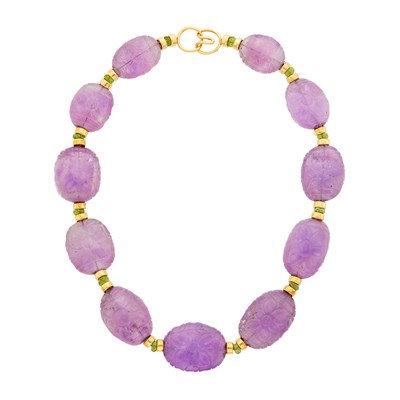 Lot 116 - Carved Amethyst Bead, Gold and Peridot Bead Necklace