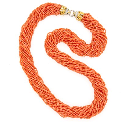 Lot 1192 - Twenty-Five Strand Coral Bead Necklace with Two-Color Gold, Diamond and Emerald Lion Head Clasp
