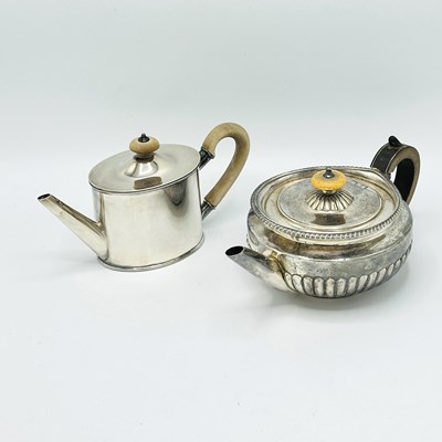 Lot 1107 - Two English Sterling Silver Teapots