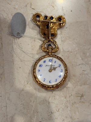 Lot 1159 - Marcus & Co. Gold, and Cabochon Sapphire Pendant-Watch