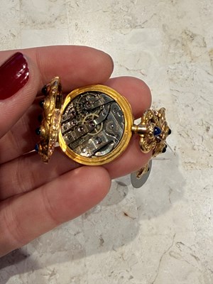 Lot 1159 - Marcus & Co. Gold, and Cabochon Sapphire Pendant-Watch