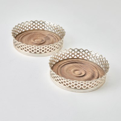 Lot 676 - Pair of Tiffany & Co. Sterling Silver Bottle Coasters