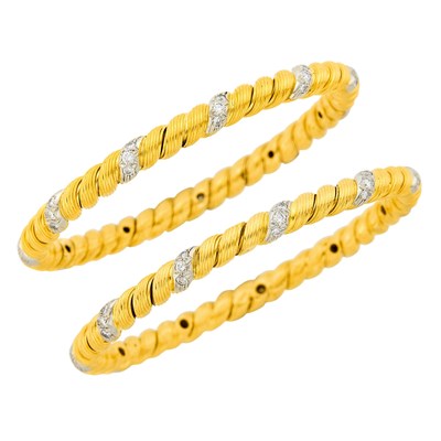 Lot 118 - Van Cleef & Arpels Pair of Fluted Gold, Platinum and Diamond Bangle Bracelets