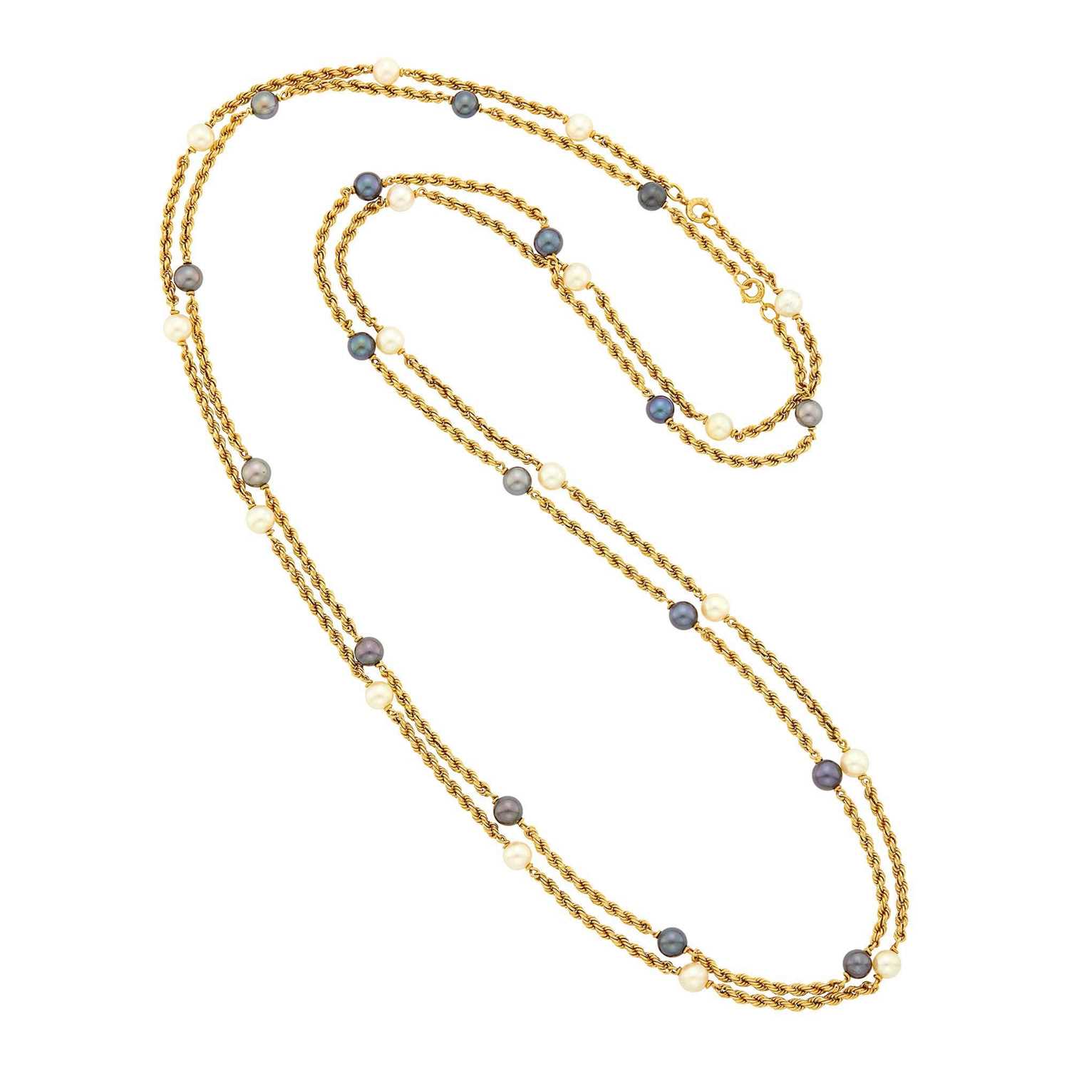 Lot 41 - Van Cleef & Arpels Pair of Long White and Black Cultured Pearl Rope-Twist Chain Necklaces, France