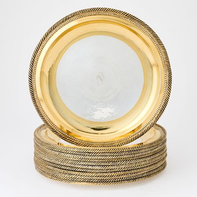 Lot 121 - Set of Twelve American Parcel-Gilt Sterling Silver Dinner Plates