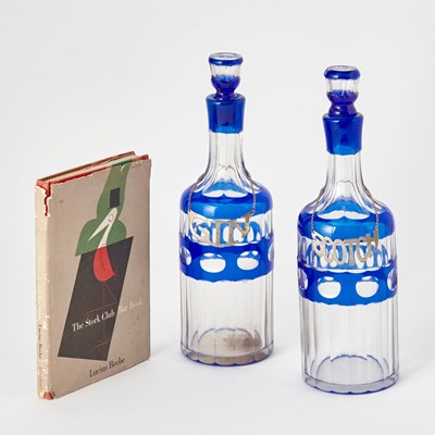 Lot 240 - Barware: The Stork Club Bar Book together with a Pair of Bohemian Style Overlay Glass Decanters