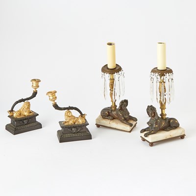 Lot 228 - Pair of Gilt and Patinated Metal Recumbent Lion Candlesticks