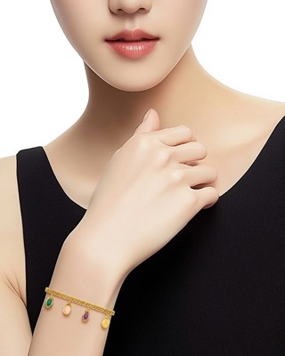 Lot 168 - Tiffany & Co., Schlumberger Gold, Rose Quartz, Amethyst, Citrine and Aventurine Quartz Charm Bracelet, France