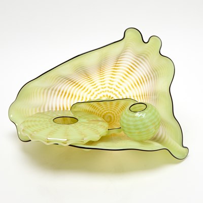 Lot 233 - Dale Chihuly Four-Piece Blown Glass Yellow Celadon Seaform Set with Black Lip Wraps