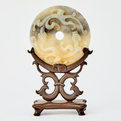 Lot 424 - A Chinese Carved Jade Bi Disc