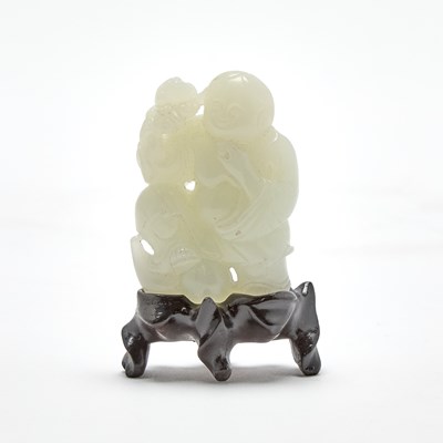 Lot 450 - A Chinese Pale Celadon Jade Figural Carving of Liu Hai