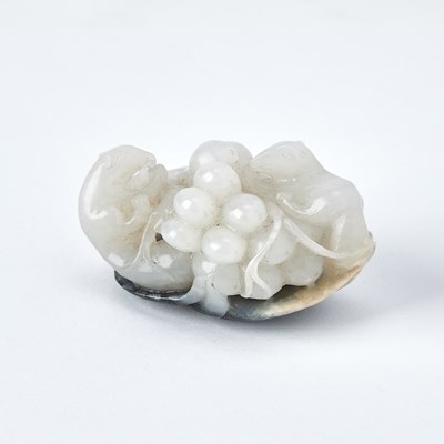 Lot 487 - A Chinese White and Grey Jade 'Squirrel and Grapes' Group
