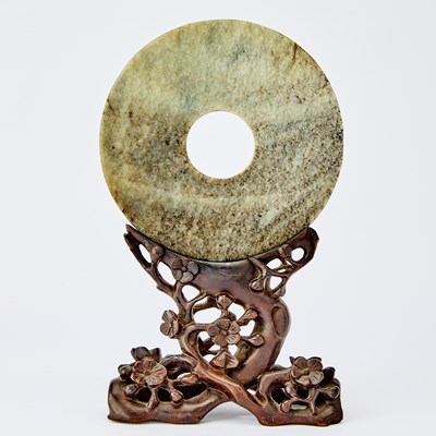 Lot 428 - A Chinese Mottled Jade Bi Disc