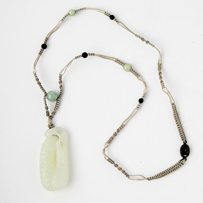 Lot 464 - A Chinese Celadon White Jade Pendant