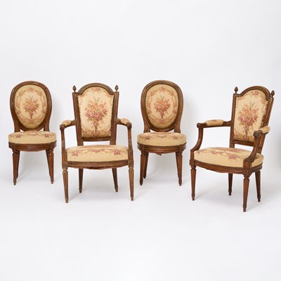 Lot 477 - Assembled Set of Four Louis XVI Beechwood and Walnut Fauteuils