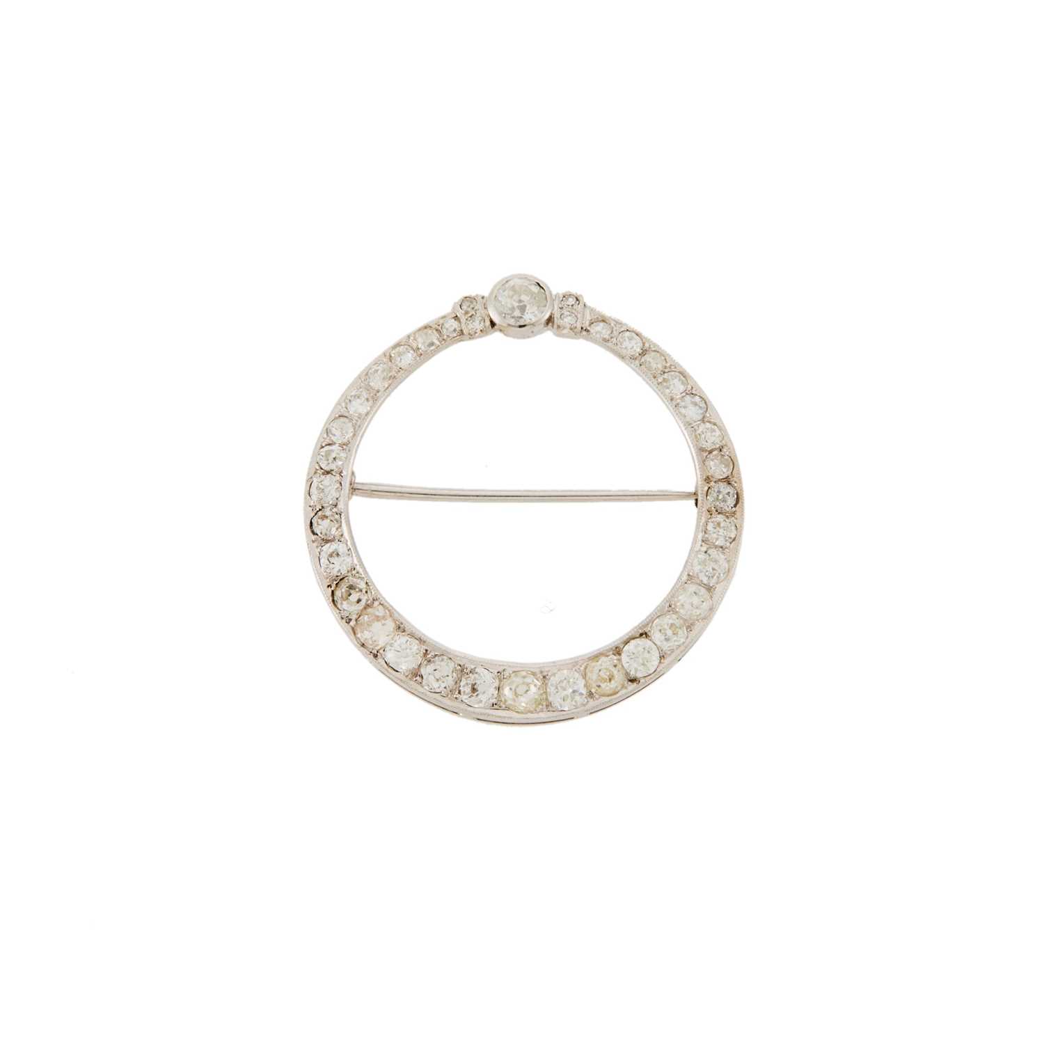 Lot 1085 - Low Karat White Gold and Diamond Circle Brooch