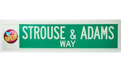 Lot 9 - A street sign for Strouse & Adams Way