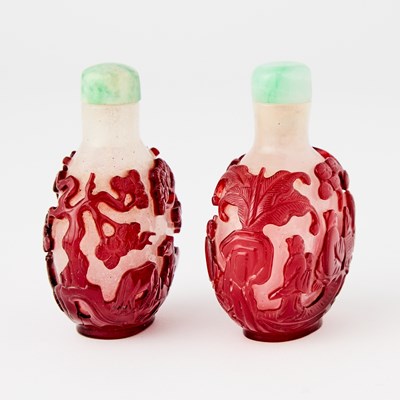 Lot 2 - A Pair of Chinese Overlay Glass Snuff Bottles