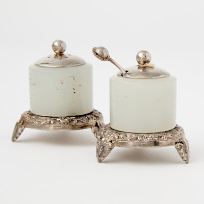 Lot 472 - A Pair of Chinese Silver-Mounted White Jade Archer Rings