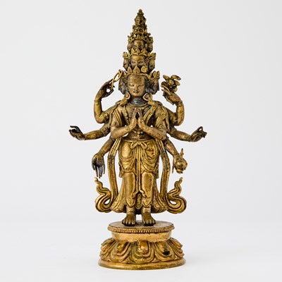 Lot 363 - A Tibetan Gilt Bronze Figure of Eleven-Headed Avalokiteshvara