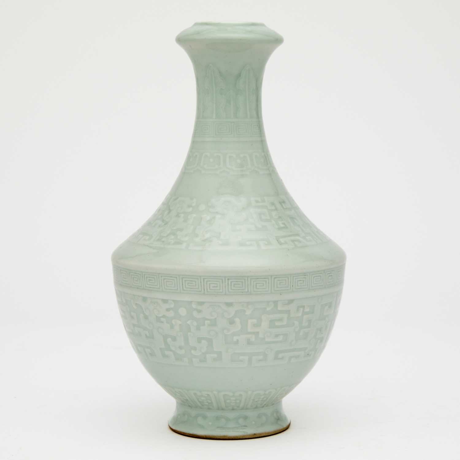 Lot 540 - A Chinese Carved Pale Celadon Glazed Porcelain Vase