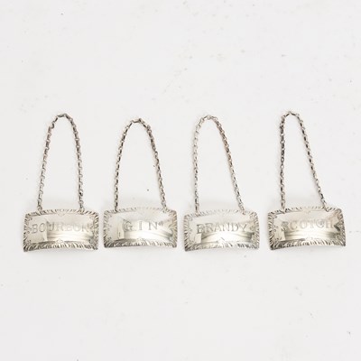 Lot 104 - Set of Four Sterling Silver Decanter Labels