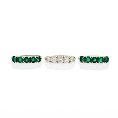 Lot 1105 - Three Platinum, Emerald and Diamond Rings