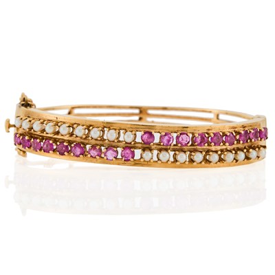 Lot 1166 - Gold, Ruby and Cultured Pearl Bangle Bracelet