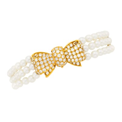 Lot 31 - Van Cleef & Arpels Triple Strand Cultured Pearl, Gold and Diamond Bow Bracelet