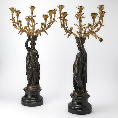Lot 884 - Pair of Louis XVI Style Gilt and Patinated Bronze Figural Seven-Light Candelabra