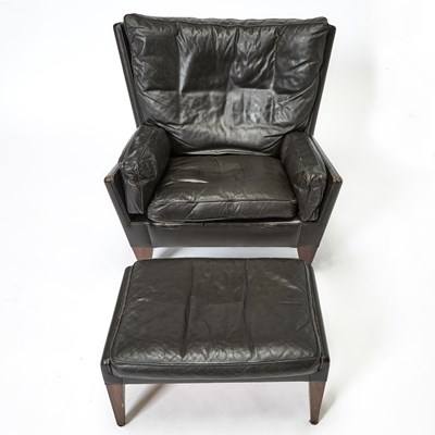 Lot 203 - Illum Wikkelso Leather Upholstered Armchair and Ottoman