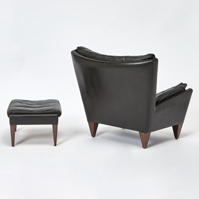 Lot 203 - Illum Wikkelso Leather Upholstered Armchair and Ottoman