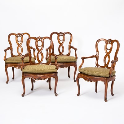 Lot 82 - Set of Four Italian Rococo Style Upholstered Walnut Open Armchairs