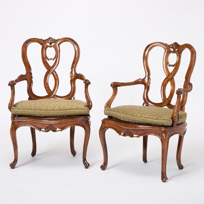 Lot 82 - Set of Four Italian Rococo Style Upholstered Walnut Open Armchairs