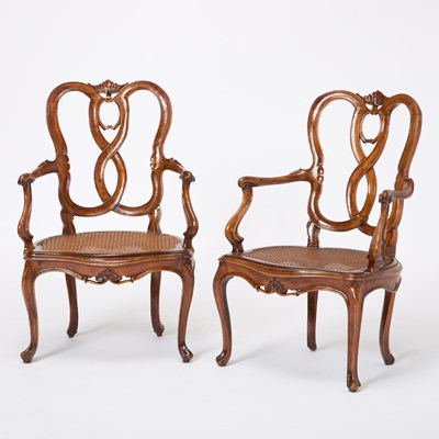 Lot 82 - Set of Four Italian Rococo Style Upholstered Walnut Open Armchairs