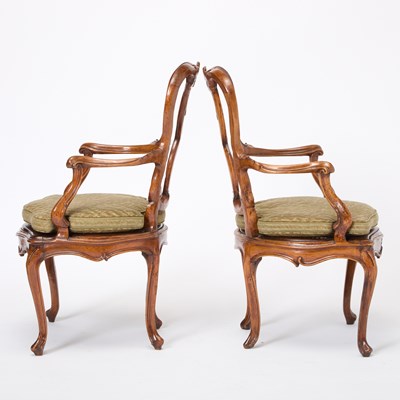Lot 82 - Set of Four Italian Rococo Style Upholstered Walnut Open Armchairs