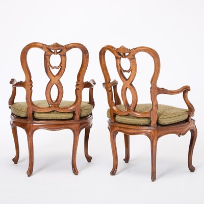 Lot 82 - Set of Four Italian Rococo Style Upholstered Walnut Open Armchairs