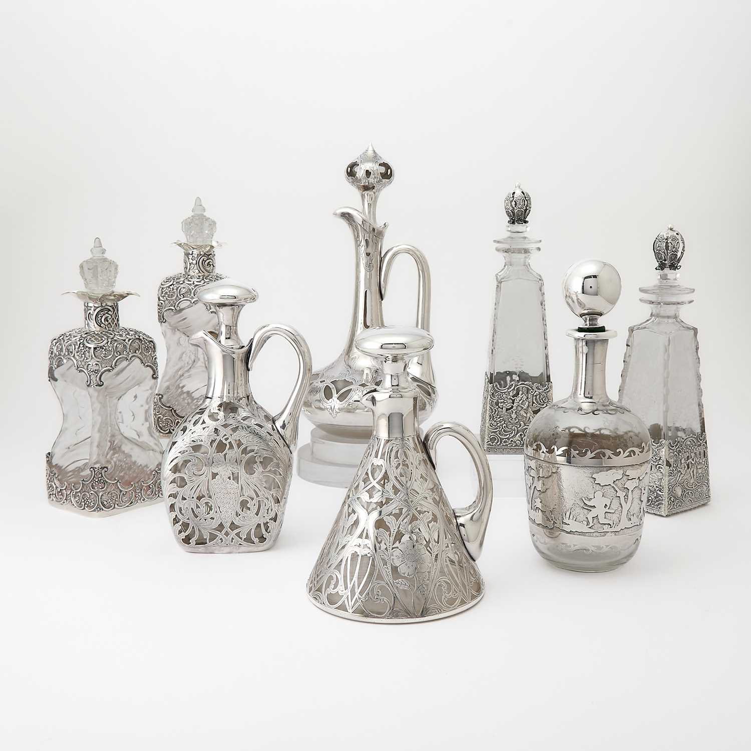 Lot 541 - Eight Silver and Glass Decanters