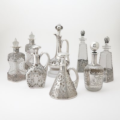 Lot 541 - Eight Silver and Glass Decanters