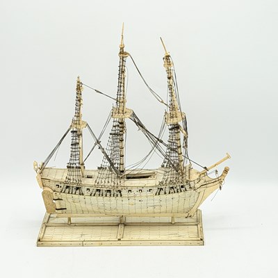 Lot 103 - Diminutive French Prisoner-of-war Bone and Ebony Ship’s Model on Stand