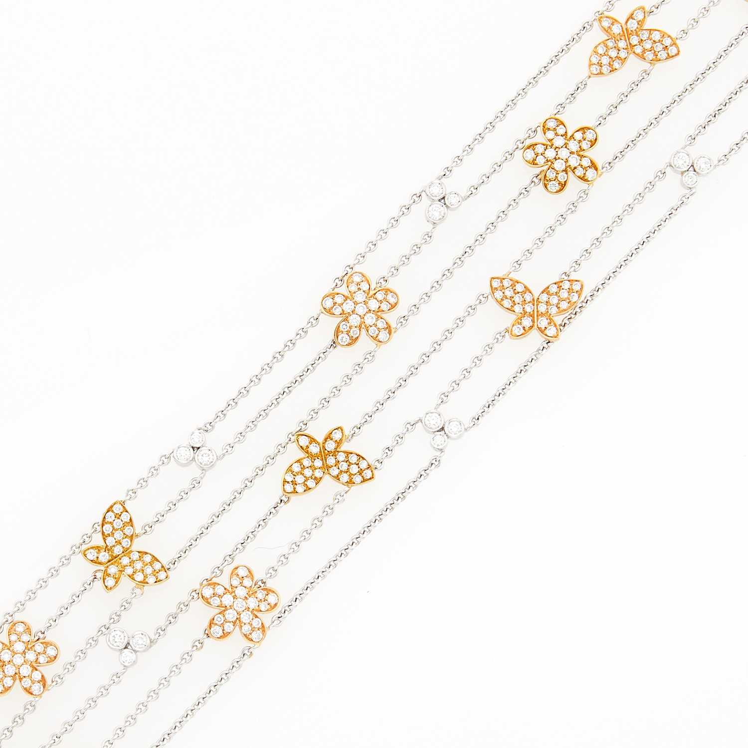 Lot 1059 - Two-Color Gold and Diamond Five Strand Bracelet