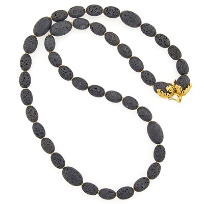 Lot 1259 - Long Lava Bead, Gold and Diamond Necklace