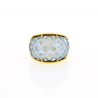 Lot 1191 - Gold and Carved Synthetic Blue Spinel Ring