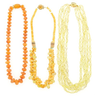 Lot 2228 - Three Lemon Quartz, Citrine, Carnelian and Fluorite Bead Necklaces with Gold Clasps