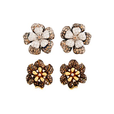Lot 2079 - Two Pairs of Yellow, White and Blackened Gold, Colored Diamond and Diamond Flower Earclips